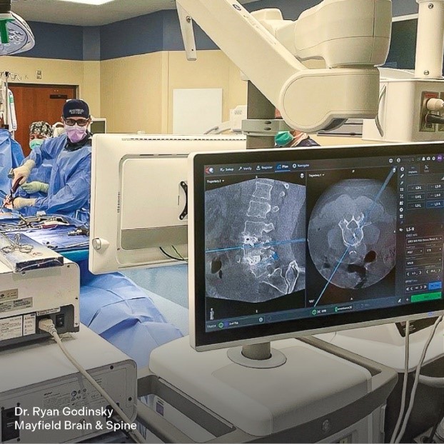 photo of Dr. Godinsky during spine surgery using ExceliusHub